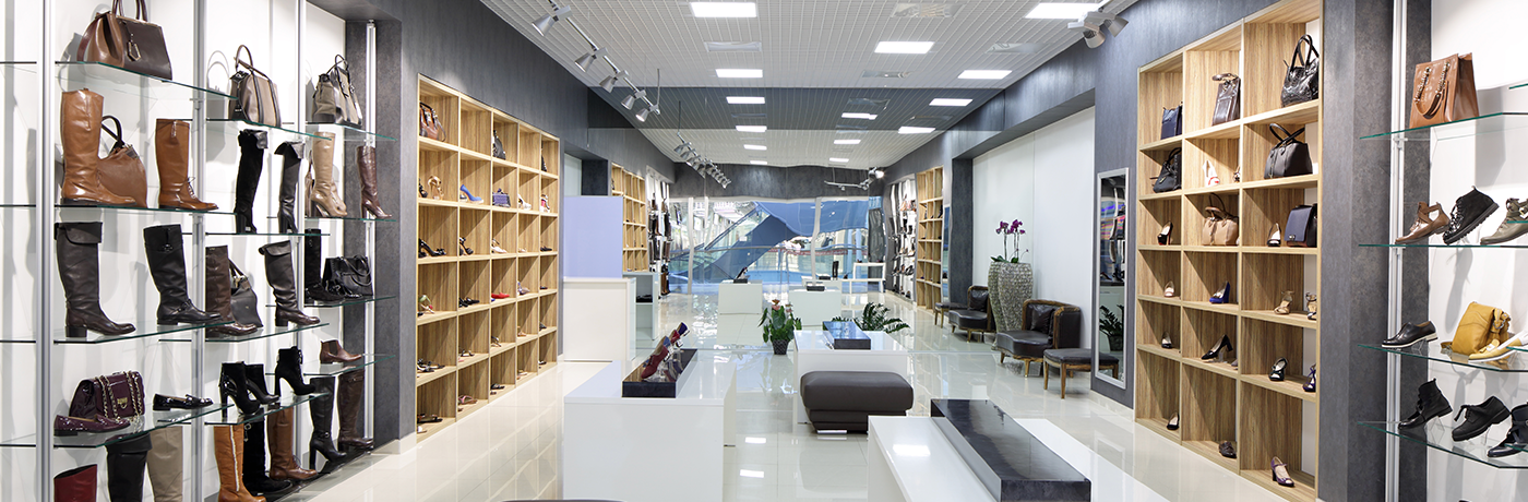 Clean retail store with shoes on the wall