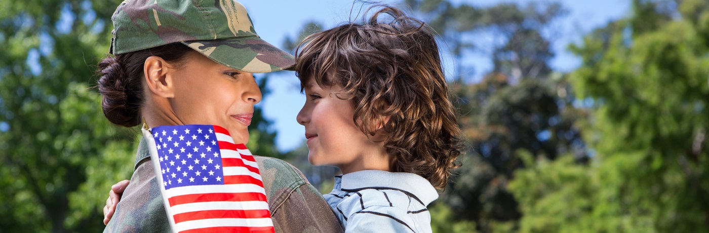 soldier and son embracing