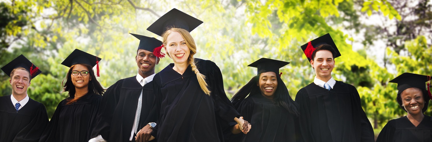 group of college graduates in cap and gown