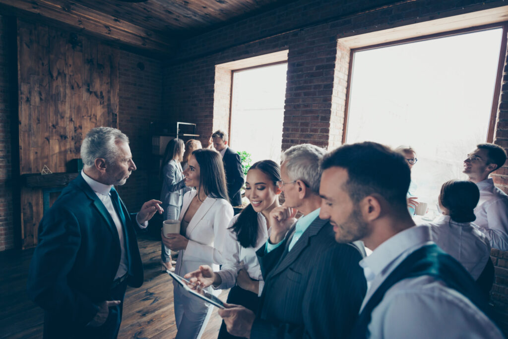 Group of diverse professionals at an office celebratory event.