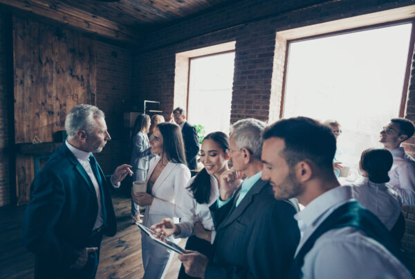 Group of diverse professionals at an office celebratory event.