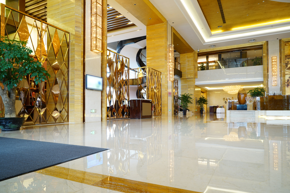 Clean, modern hotel lobby featuring clean flooring and clean carpeting.