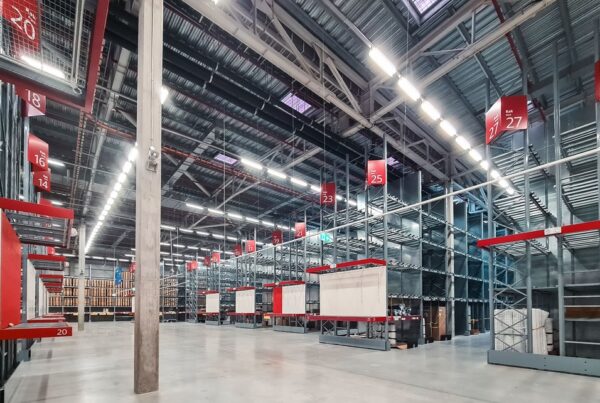 Wide angle, Interior shot of a warehouse with clean floors.