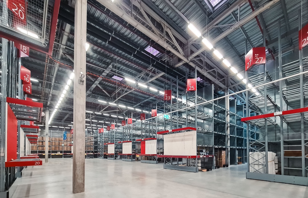 Wide angle, Interior shot of a warehouse with clean floors.