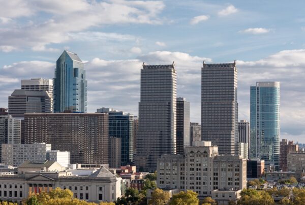 Downtown Philadelphia on a partly sunny sky showcasing the downtown buildings.