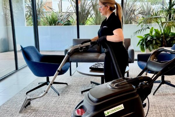 Core4 - Woman in an office with a hot water carpet cleaner