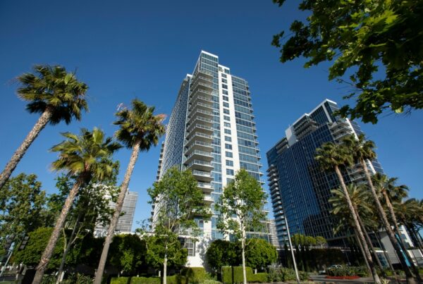 outdoor image of a skyscraper with palm trees in Orange County, CA
