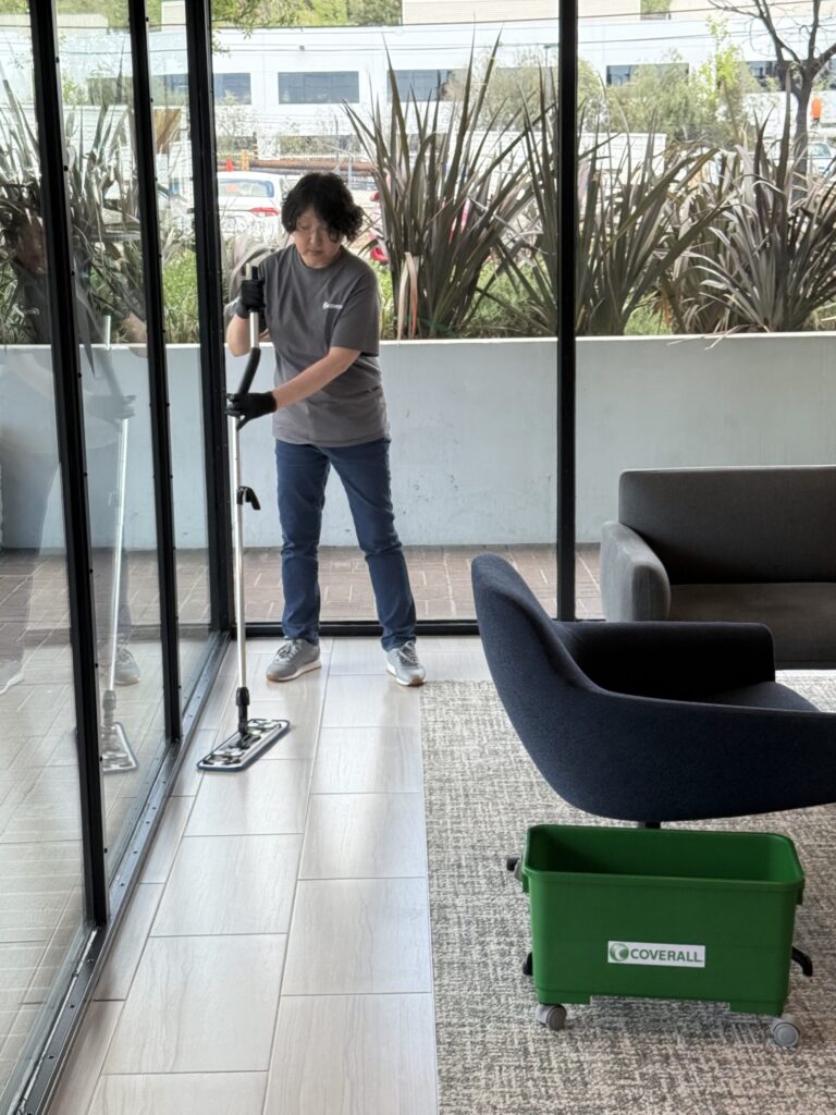 Commercial cleaner mopping an office floor